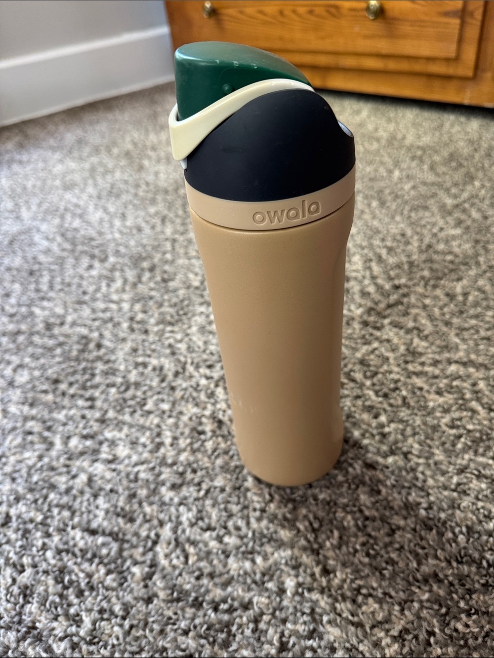 Owala Beige Travel Bottle with Green Flip Lid